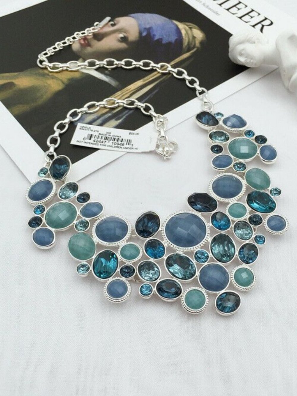 Nine West Statement Necklace in silver with multi-blue "gems"